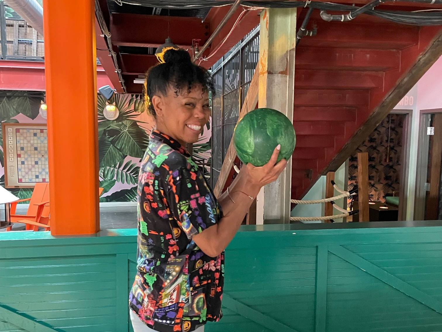 Happy employee playing bowling