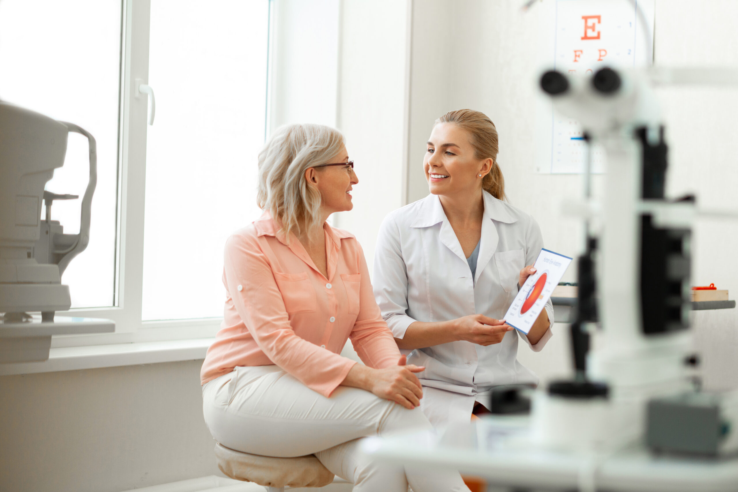 Important,conversation.,beaming,long Haired,woman,having,appointment,with,older,patient