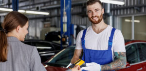 Young,smiling,happy,professional,car,mechanic,man,in,blue,overalls