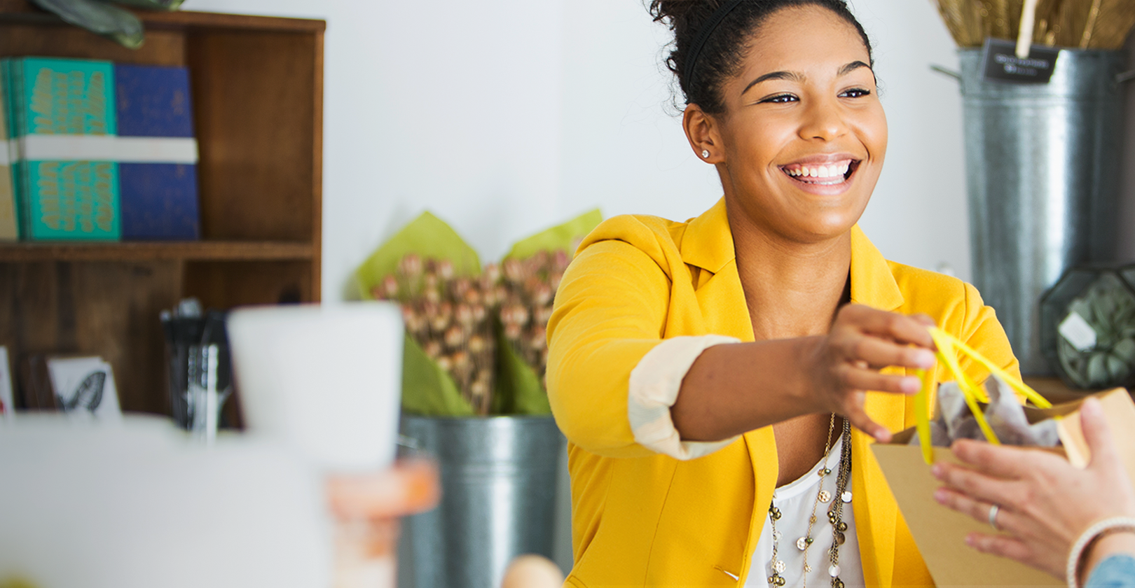 Hero Homepage Appstar home hero | happy shop owner serving customer